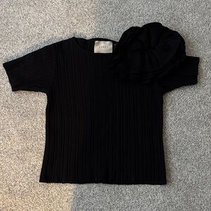 Elegant Black Ribbed Sweater with Floral Accent